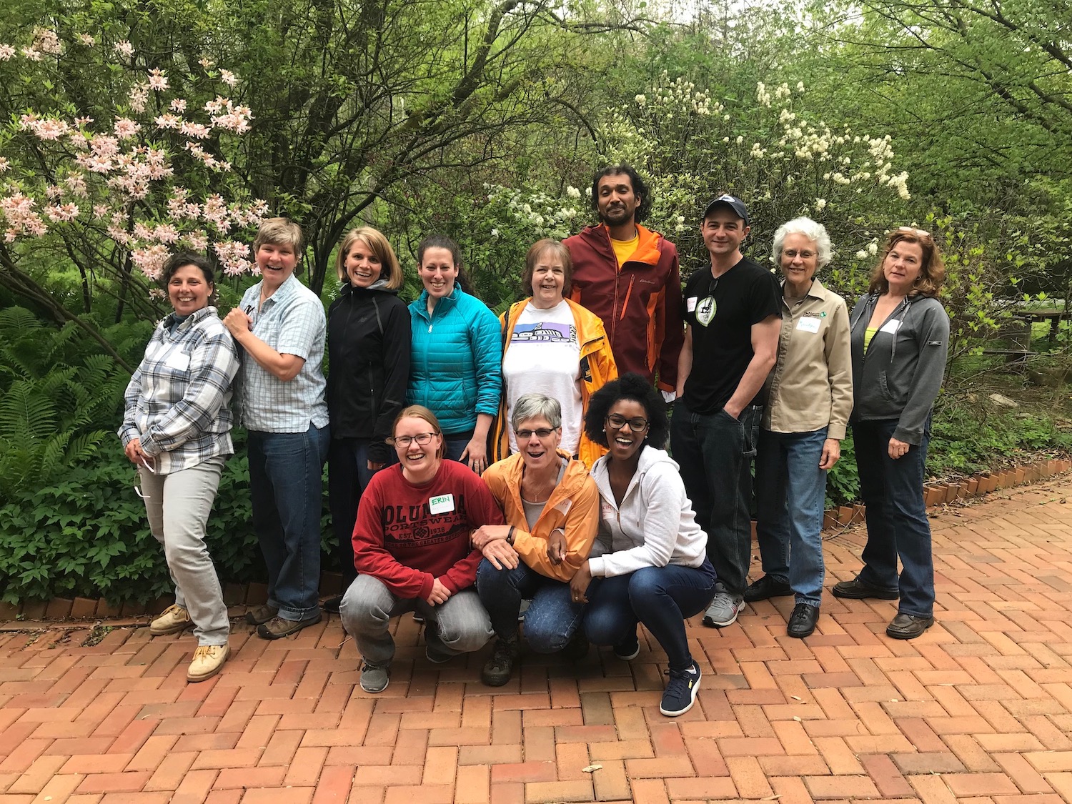 Sierra Club volunteer leaders smiling in a small group outside.