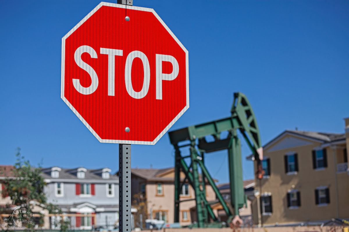 Photo: Oil well and pumpjacks near housing developments in the City of Signal Hill. Once a massive oil producing area, oil wells are still mixed in its now residential neighborhoods. Los Angeles Coutny, California, USA by Peter Bennett