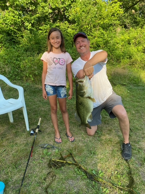 Image of kid and dad catching fish